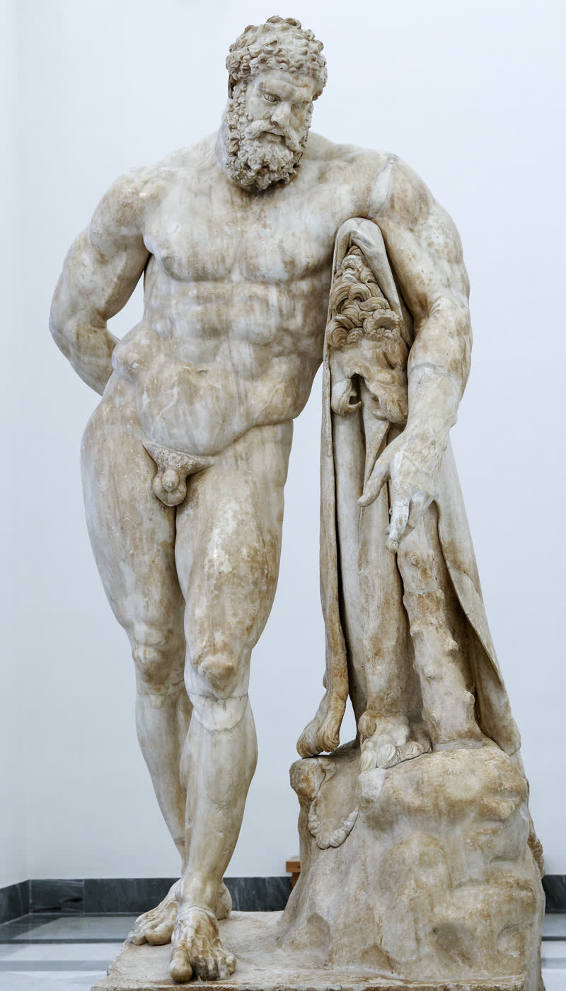 Héracles de pé e exausto, o corpo pesado descansando sobre a clava em que está pendurada a pele do leão, o braço direito dobrado às costas. Cópia romana em mármore assinada por Glícon de Atenas, de um original grego do início do período helenístico; o antebraço esquerdo é restauração em gesso. Museu Arqueológico Nacional de Nápoles (inv. 6001).